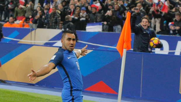 France's Dimitri Payet celebrates his side's second goal against Sweden on the first anniversary since the Paris attacks.