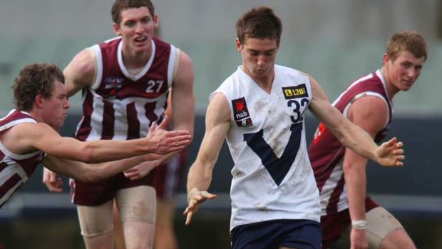 Country prospect Shaun Atley gets a kick away during yesterday's win.