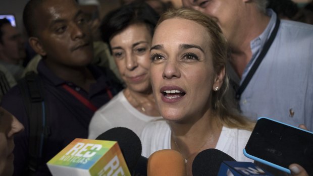 Lilian Tintori, wife of jailed opposition leader Leopoldo Lopez, speaks to the media after hearing the results.