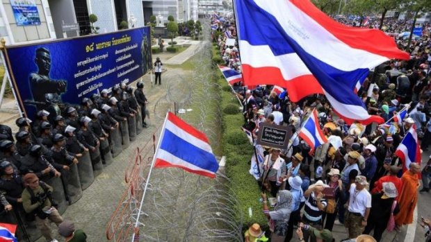 Stand-off: Thai police and demonstrators face each other in Bangkok. 