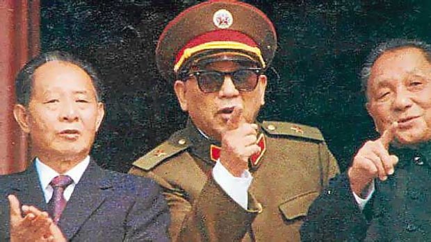 General Qin Jiwei (centre)  with Deng Xiaoping (right), in 1984.