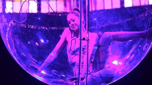 Lucia Carbines (Miss A)  shows off her astonishing physical elasticity within the confines of a suspended Perspex ball in <i>Empire</i>.