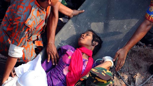 Daylight: Reshma Akhter, 18, is pulled from the collapsed Rana Plaza in Bangladesh.