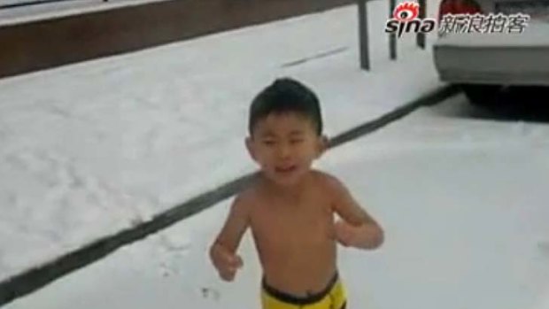 Controversial footage ... the boy cries in the snow.
