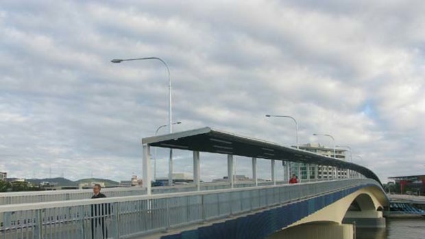 Pedestrians make use of Brisbane's latest river crossing.