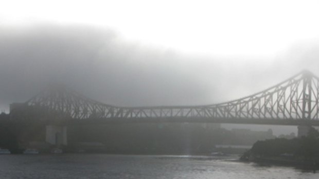 Fog envelops Brisbane's Story Bridge this morning.