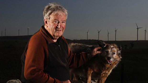 Blown away... George McLaughlin and his dog, Scooter, on the Tarago property he has left because of the noise from the nearby wind farm.