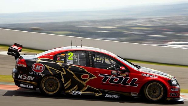 In the red corner ... Holden Racing Team driver Garth Tander, pictured in practice yesterday, says the addition of new manufacturers next year will not diminish the traditional Ford-Holden rivalry.