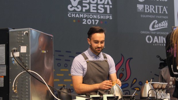 ONA Coffee's head roaster, Sam Corra on stage during the competition in Budapest.
