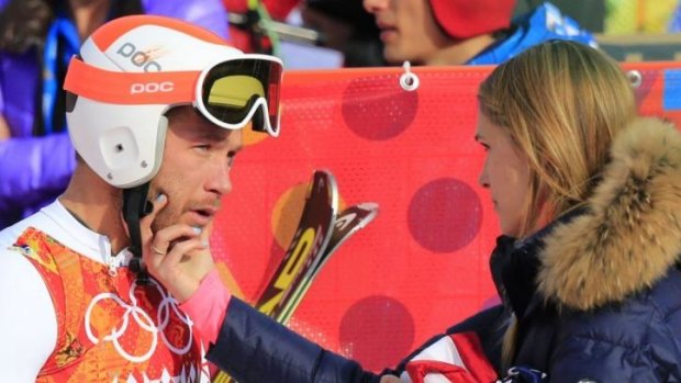 Difficult line of questions ... US skier Bode Miller is comforted by his wife Morgan Beck after the Men's Alpine Skiing Super-G at the Rosa Khutor Alpine Centre.