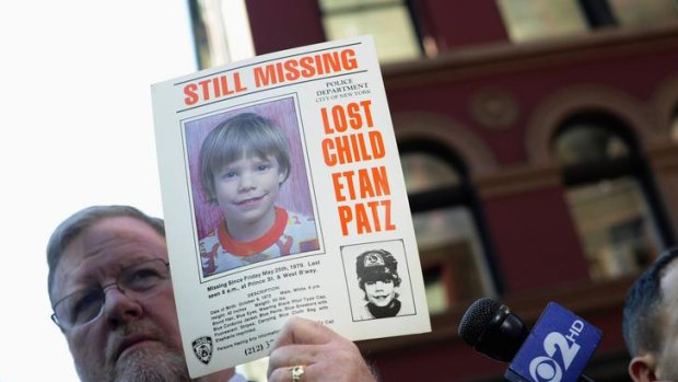 New York Police spokesman Paul Browne with the original missing poster.