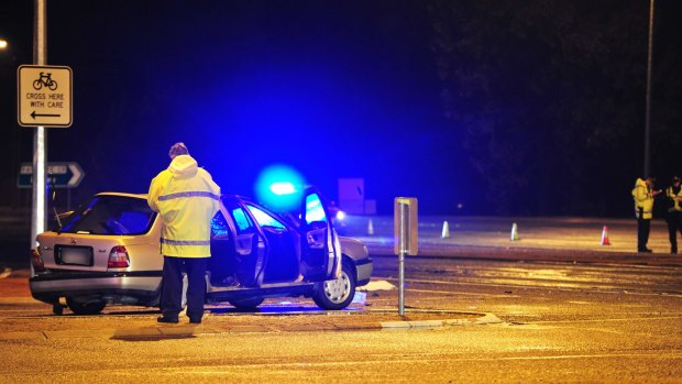 ACT police officers at the scene of the accident at the corner of Southern Cross Drive and Chewings Street.