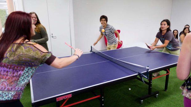 Workers play ping-pong during a break at Catch of the Day in Mulgrave.