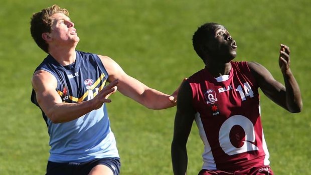 Jacob Hopper and Reuben William in action during the AFL Under 18 championships match between NSW/ACT and Queensland.