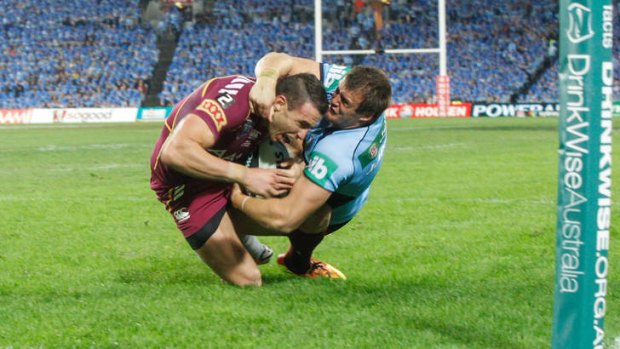 Ready for another onslaught: Josh Morris brings down Darius Boyd in game one.