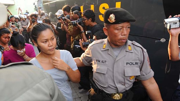 Evacuatred ... female inmates are escorted out of Kerobokan prison after two days of rioting.