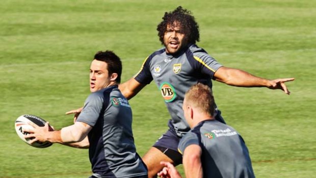 Kumuls clash ... Cooper Cronk, left, and Sam Thaiday train with the Kangaroos for the Four Nations clash with Papua New Guinea at Parramatta Stadium tomorrow.