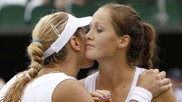 Sabine Lisicki of Germany (L) kisses Bojana Jovanovski of Serbia but later complained about her grunting.