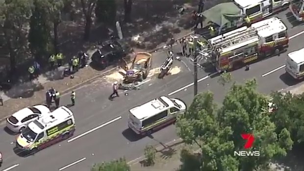 Emergency services at the scene of a car crash at Cabramatta  in which a woman and man have died. 