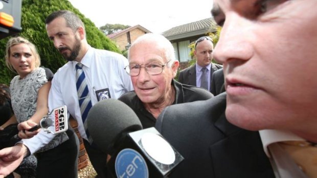 Detained: Detectives arrest Roger Rogerson at his Padstow Heights home in May.