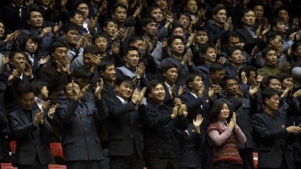 North Koreans cheer during an exhibition basketball game between US and North Korean players at an indoor stadium in Pyongyang.