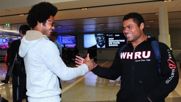 Henry Speight greets his brother Sam at Canberra Airport on Wednesday.