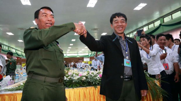 Sealing the deal: Myanmar Lieutenant General Myint Soe, left, and Deputy Chief of Staff Guam Maw.