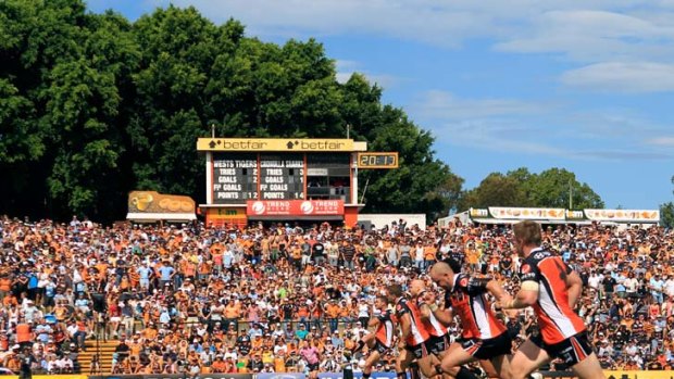 Under threat ... Suburban grounds, such as the Wests Tigers' Leichhardt Oval, with its famous hill, could become a thing of the past for fans. Instead, they may be forced out of their geographic areas to watch their teams play in more modern venues.