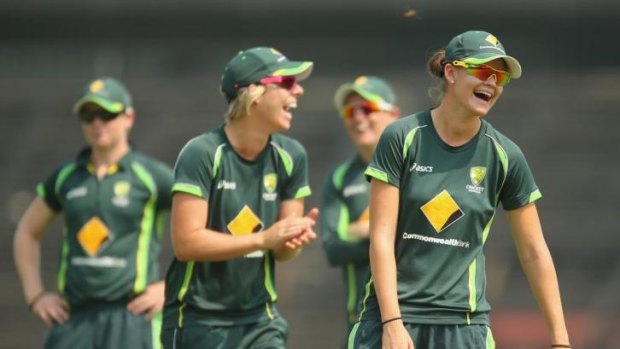Jess Jonassen (right) and Elyse Villani share a laugh during a nets session ahead of the ICC World Twenty20 Women's final.
