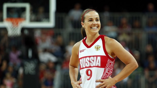 International: Becky Hammon smiles toward her bench during the women's preliminary round Group B basketball match while playing for Russia against Brazil at the London 2012 Olympic Games.