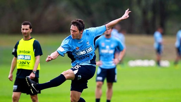 Back in the fold . . . former Sky Blue Mark Milligan works out with Sydney FC yesterday.