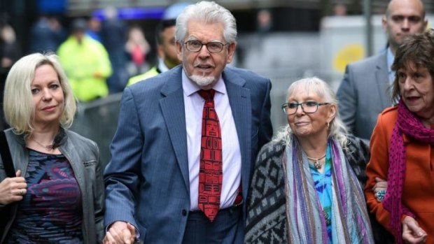 Rolf Harris arrives with his wife Alwen Hughes (second from right) and daughter Bindi (left) at Southwark Crown Court.