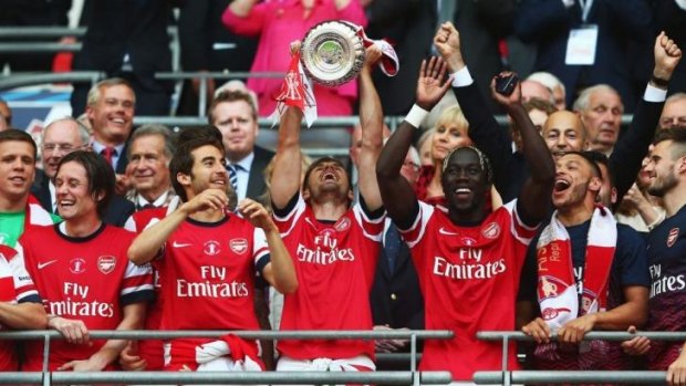 Drought over: Arsenal celebrate their first trophy since 2005.