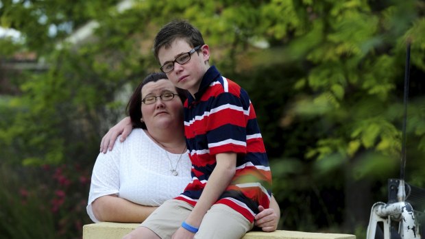Danielle McMahon, of Ngunnawal, at her home with her 13-year-old
autistic son Jay.