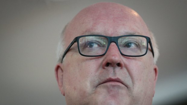 Canberra's legal fraternity has urged federal Attorney-General George Brandis to reverse savage cuts to the legal aid sector. 