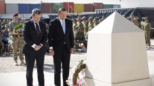 Opposition Leader Bill Shorten and Prime Minister Tony Abbott lay wreaths during a recognition ceremony in Tarin Kowt, Oruzgan Province, Afghanistan to honour the 40 Australian lives lost during the conflict.