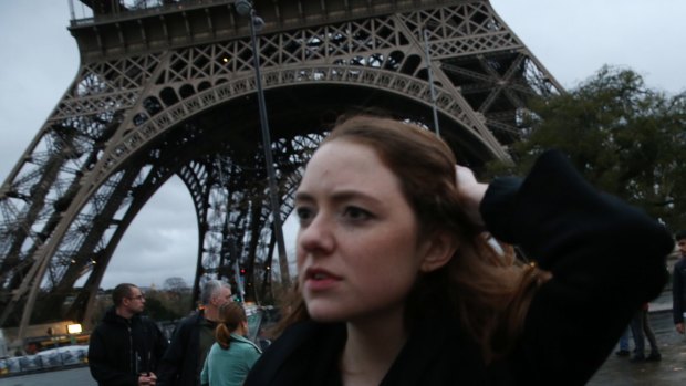 Tourists flee as Police clear the Eiffel Tower.