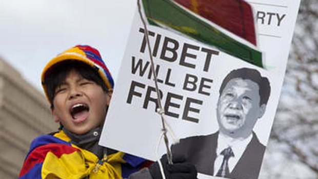 A young Free Tibet supporter protests outside the White House, Sunday, February 12, 2012, in Washington.