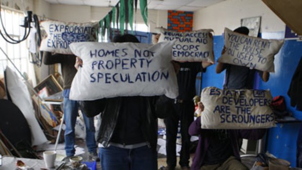 Pillow talk...activists in an East London flat prepare for a day of action on the streets of London.