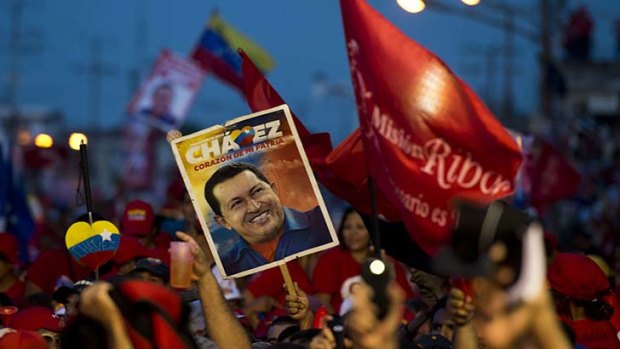 Closing ... Chavez supporters at a campaign rally in Carabobo state this week. Polls give President Chavez a mere 10-point advantage over rival Henrique Capriles.