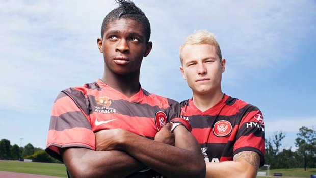 Multicultural stars: Kwabena Appiah-Kubi (left) came from Ghana 11 years ago, pictured with Aaron Mooy, whose grandfather came from the Netherlands. The Wanderers reflect the diversity of western Sydney.