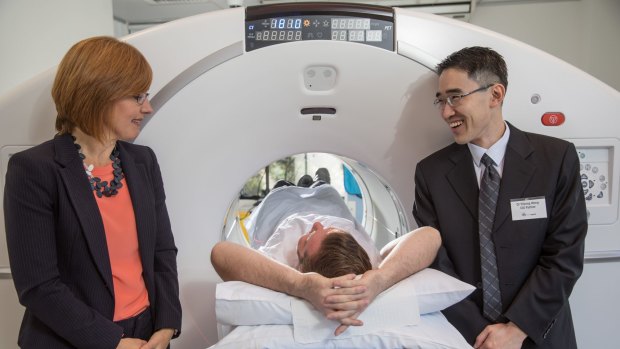 ACT Minister for Health Meegan Fitzharris with CIG radiologist, Will Cole acting as a patient and CIG PET/CT radiologist Dr Yiisong Wong .