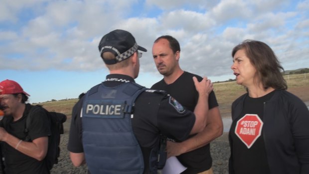 NSW Greens upper house MPs Jeremy Buckingham and Dawn Walker are arrested in central Queensland on Wednesday following an anti-Adani protest. 