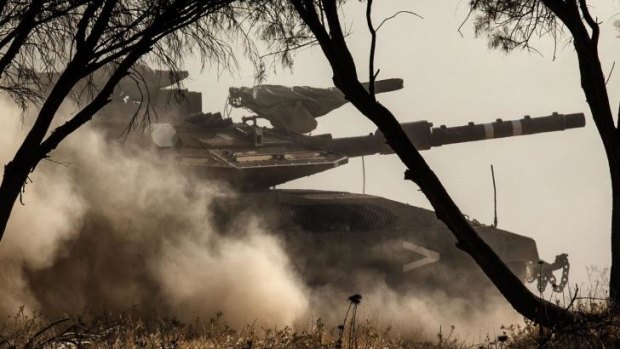 An Israeli tank at an army deployment area near Israel's border with the Gaza Strip.