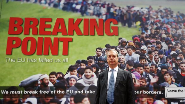 Nigel Farage with the controversial campaign poster.