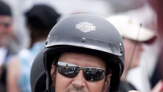 Todd Palin, husband of Sarah Palin,   adjusts his helmet before taking part in the Rolling Thunder motorcycle ride.