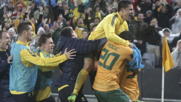 Heading to Rio: The Socceroos celebrate the winning goal.