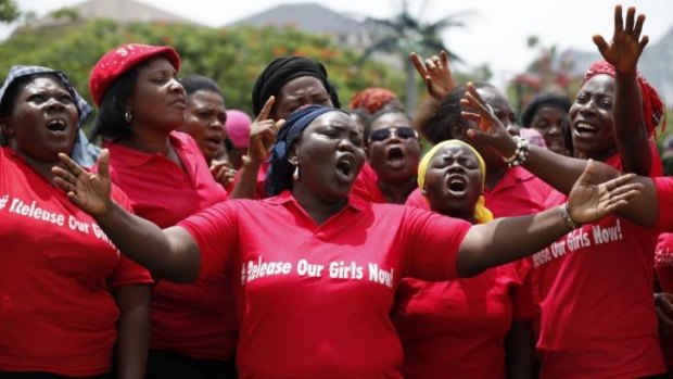 Women sing at a prayer meeting calling on the Nigerian government to rescue the kidnapped girls.