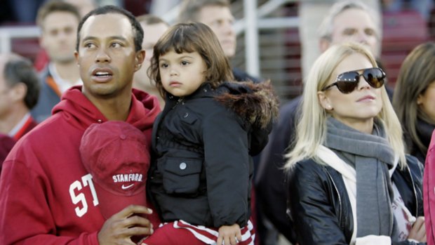Tiger Woods with his daughter Sam and wife Elin Nordegren at an American football game earlier this month.