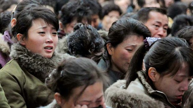 Tears for the 'Dear Leader' ... North Korean women cry after learning of death of Kim Jong-il.